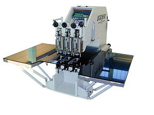 Punching machine to punch foils on a granite table.jpg